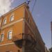 A yellow building with a balcony, dedicated to Transylvanian History.