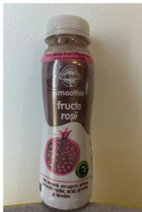 A bottle of pomegranate smoothie involved in a Smoothie Recall on a table.