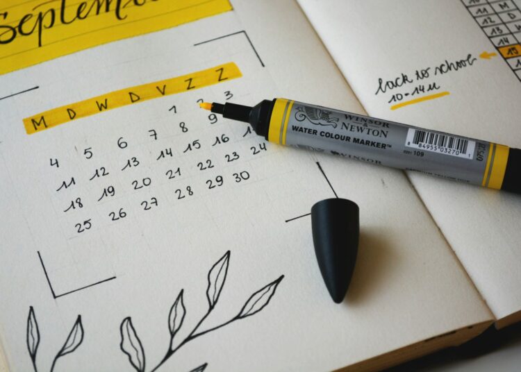 black marker on notebook